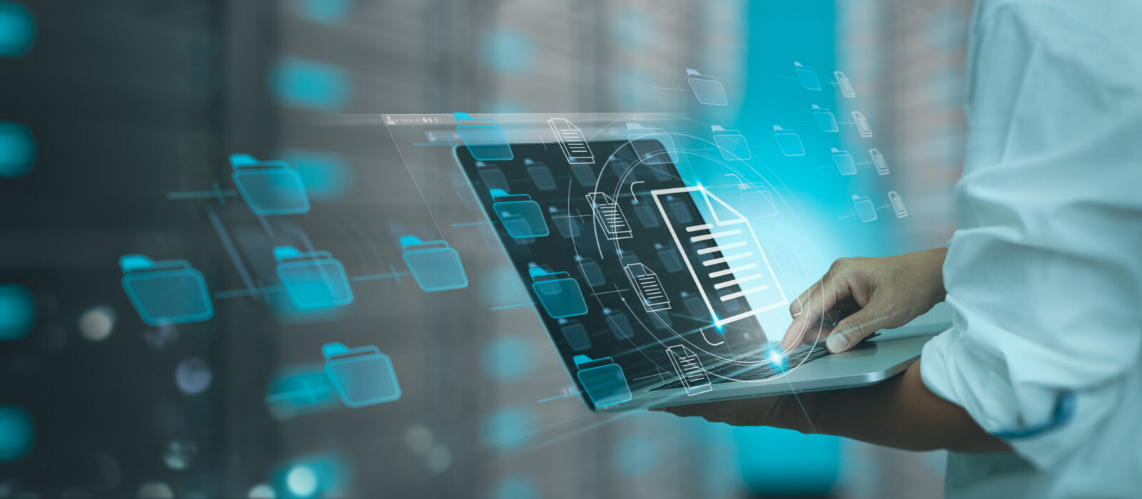A person typing on a laptop with translucent blue folder and document icons floating in a digital network overlay.